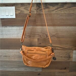 Tan Crossbody Bag with Adjustable Strap and Metal Accents